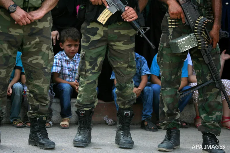 Members of Ezzedin al-Qassam Brigades, the armed wing of Hamas movement, take part in a graduation ceremony of a military-style camp organized by the Hamas movement in Khan Younis in the southern Gaza Strip, on August 5,...