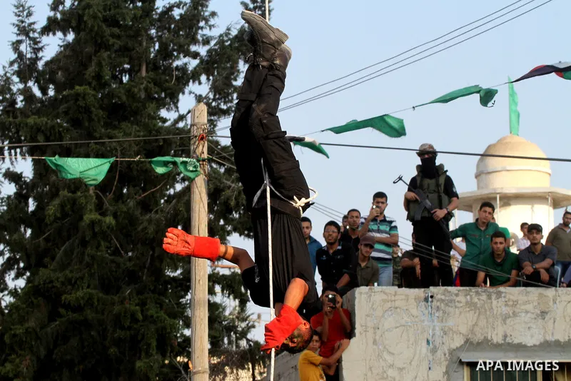 A Palestinian youth demonstrates his skills during a graduation ceremony of a military-style camp organized by the Hamas movement in Khan Younis in the southern Gaza Strip, on August 5, 2015. Hamas's armed wing organized...