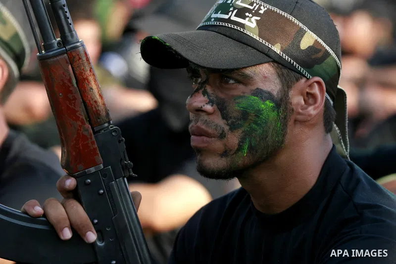 Palestinian youths take part in a graduation ceremony of a military-style camp organized by the Hamas movement in Khan Younis in the southern Gaza Strip, on August 5, 2015. Hamas's armed wing organized ''Liberation Youth...