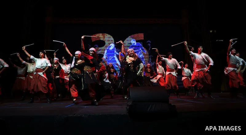 Dancers of Palestinian popular art troupe perform during the second night of the 16th Palestine International Dance Festival in the West Bank city of Ramallah on Aug. 5, 2015. Photo by Shadi Hatem