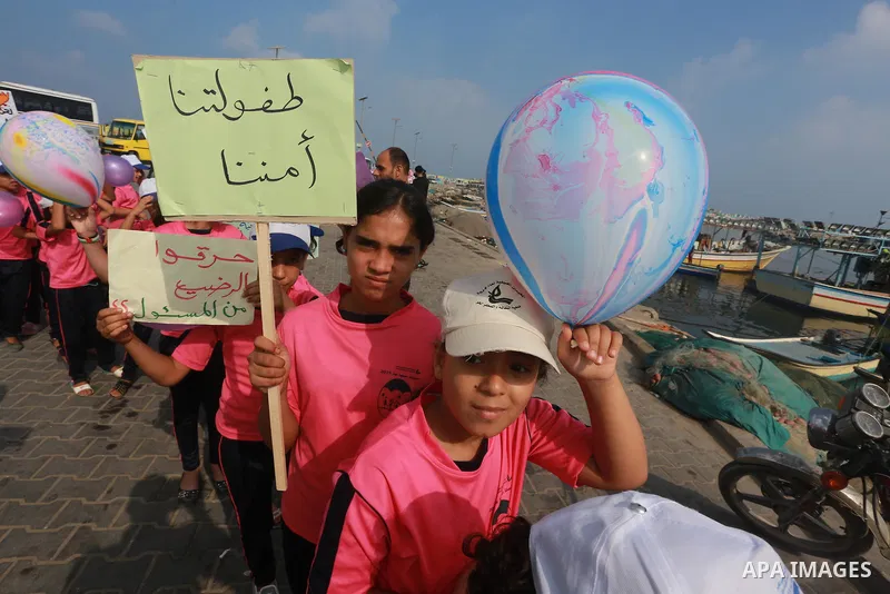 Palestinian childern take part a protest against the killing of 18-month-old Palestinian Ali Saad Dawabsheh, the toddler who was burned to death by suspected Jewish extremists, at the Seaport of Gaza city, on August 6, 2...
