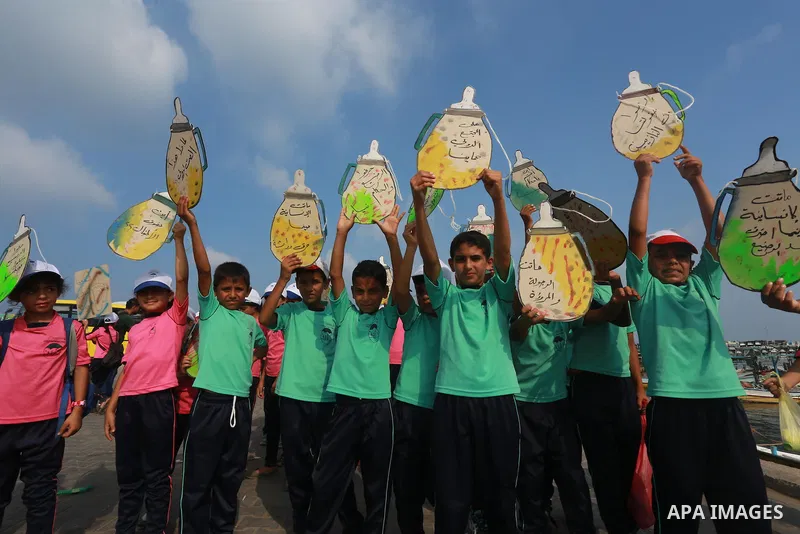 Palestinian childern take part a protest against the killing of 18-month-old Palestinian Ali Saad Dawabsheh, the toddler who was burned to death by suspected Jewish extremists, at the Seaport of Gaza city, on August 6, 2...