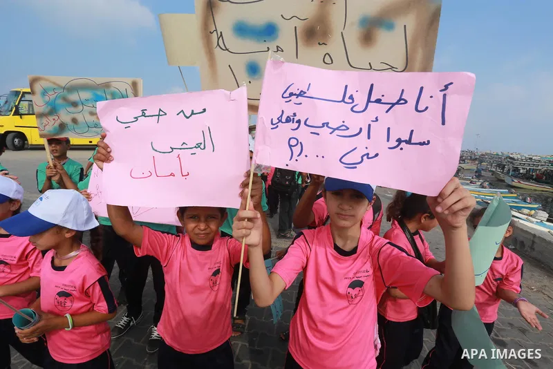 Palestinian childern take part a protest against the killing of 18-month-old Palestinian Ali Saad Dawabsheh, the toddler who was burned to death by suspected Jewish extremists, at the Seaport of Gaza city, on August 6, 2...