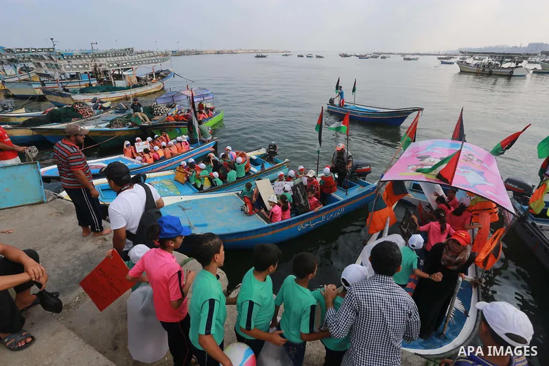 Palestinian childern take part a protest against the killing of 18-month-old Palestinian Ali Saad Dawabsheh, the toddler who was burned to death by suspected Jewish extremists, at the Seaport of Gaza city, on August 6, 2...