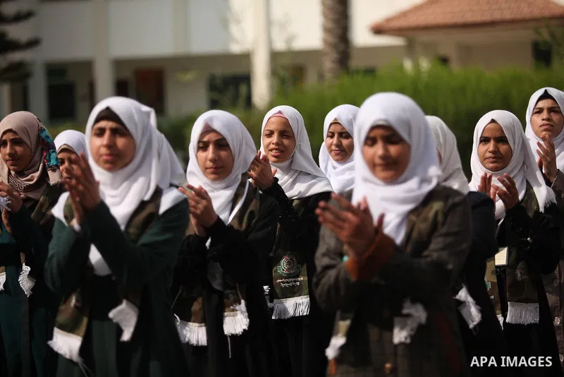 Palestinian girls perform exercises during a summer camp, organised by the Hamas movement, in Deir al-Balah in the center of Gaza Strip August 6, 2015. Photo by Ashraf Amra