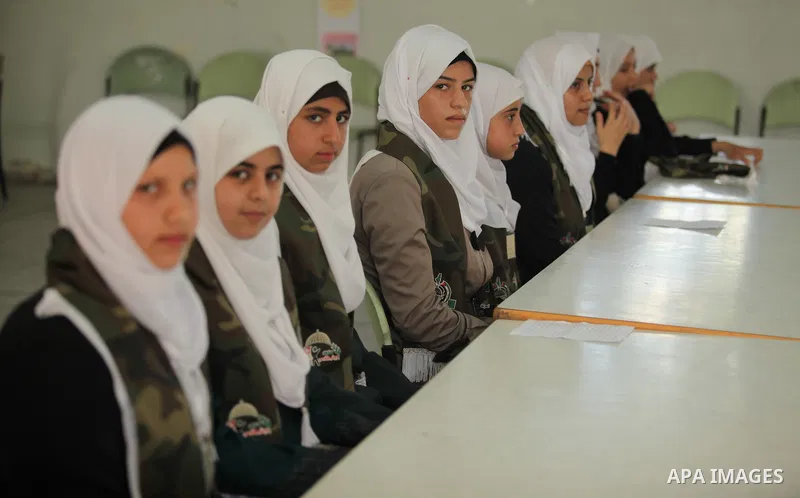 Palestinian girls perform exercises during a summer camp, organised by the Hamas movement, in Deir al-Balah in the center of Gaza Strip August 6, 2015. Photo by Ashraf Amra