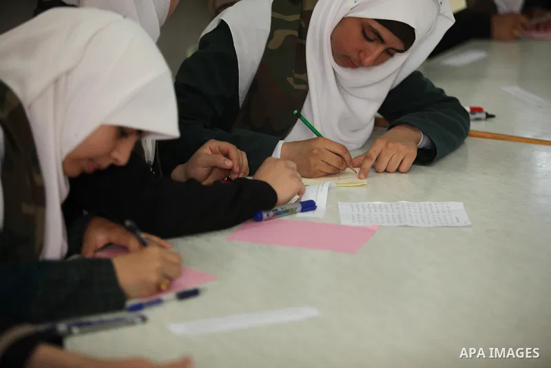 Palestinian girls perform exercises during a summer camp, organised by the Hamas movement, in Deir al-Balah in the center of Gaza Strip August 6, 2015. Photo by Ashraf Amra
