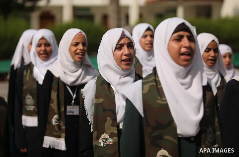 Palestinian girls perform exercises during a summer camp, organised by the Hamas movement, in Deir al-Balah in the center of Gaza Strip August 6, 2015. Photo by Ashraf Amra