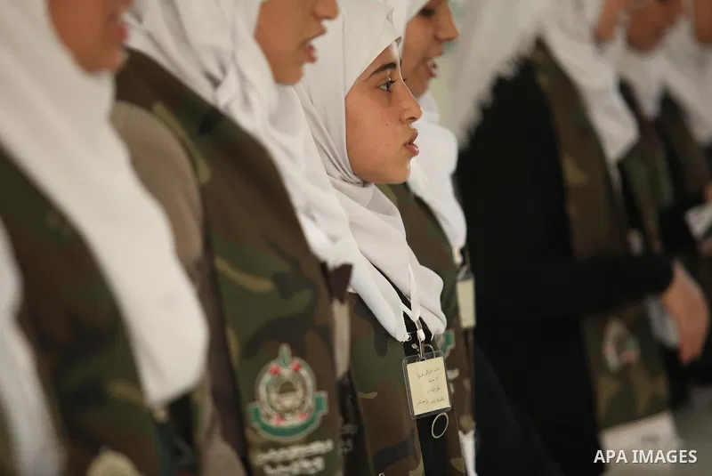 Palestinian girls perform exercises during a summer camp, organised by the Hamas movement, in Deir al-Balah in the center of Gaza Strip August 6, 2015. Photo by Ashraf Amra