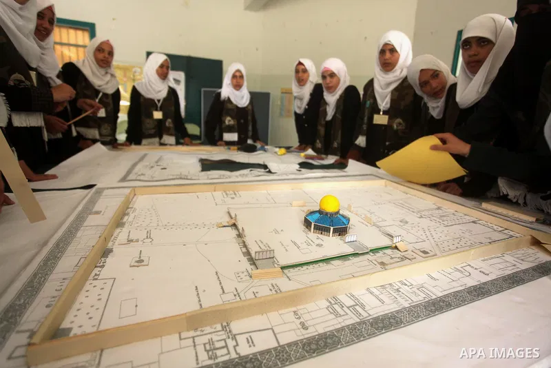 Palestinian girls perform exercises during a summer camp, organised by the Hamas movement, in Deir al-Balah in the center of Gaza Strip August 6, 2015. Photo by Ashraf Amra