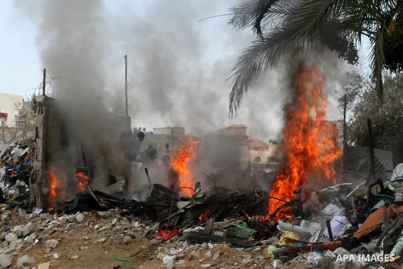 Palestinians gather at the site of an explosion that ripped through a house in the Al-Shabura refugee camp near the southern Gaza Strip town of Rafah on August 6, 2015. The blast killed at least two people and wounded 20...
