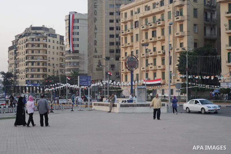 Supporter of Egyptian President Abdel-Fattah el-Sissi celebrate for Thursday's opening of the new extension of the Suez Canal, at Tahrir square, in cairo, Egypt, Thursday, Aug. 6, 2015. Egypt is to unveil a major extensi...