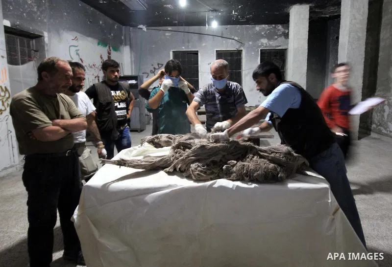 Syrian medics inspect a body of 10-month-old baby girl that killed following a shelling attack by forces of Syria's President Bashar al-Assad, in the northern Syrian city of Aleppo, on August 6, 2015. Photo by Ameer al-H...