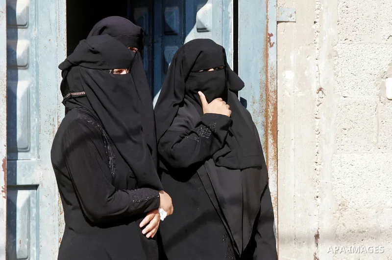 Palestinian women look on during the funeral of three victims from Abu Nuqeira family, who were killed in an explosion that ripped through a house in the Al-Shabura refugee camp near the southern Gaza Strip town of Rafah...