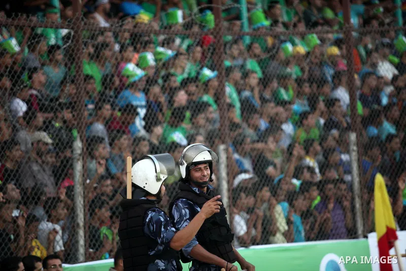 Fans attend the first leg match of the Palestine Cup final between Palestinian Gaza's Shejaya team and Hebron's Al-Ahly team at Yarmuk stadium in Gaza City, on August 6, 2015, as the two teams play each other for the fir...