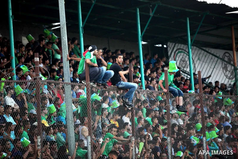 Fans attend the first leg match of the Palestine Cup final between Palestinian Gaza's Shejaya team and Hebron's Al-Ahly team at Yarmuk stadium in Gaza City, on August 6, 2015, as the two teams play each other for the fir...