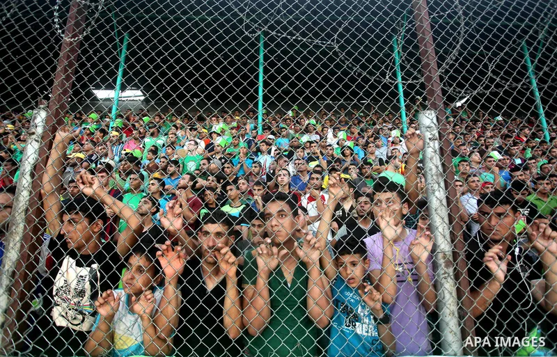 Fans attend the first leg match of the Palestine Cup final between Palestinian Gaza's Shejaya team and Hebron's Al-Ahly team at Yarmuk stadium in Gaza City, on August 6, 2015, as the two teams play each other for the fir...
