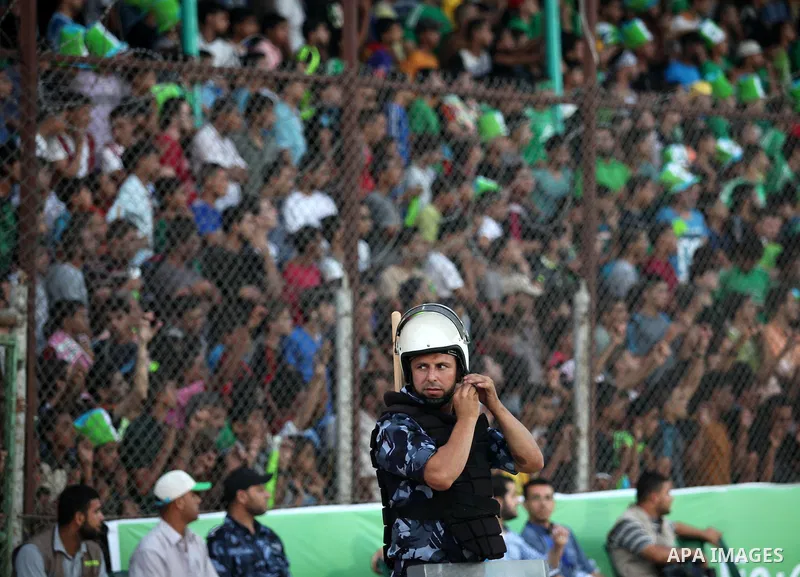Fans attend the first leg match of the Palestine Cup final between Palestinian Gaza's Shejaya team and Hebron's Al-Ahly team at Yarmuk stadium in Gaza City, on August 6, 2015, as the two teams play each other for the fir...
