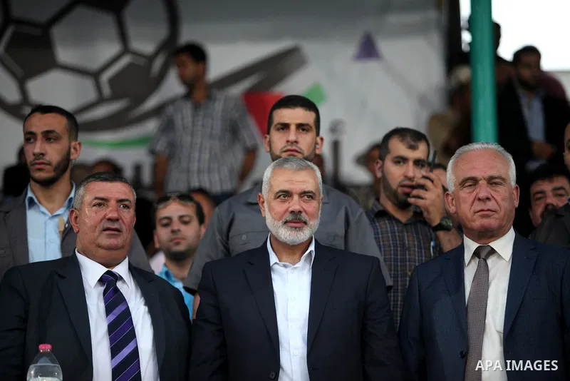 Senior Hamas leader Ismail Haniyeh, attends the first leg match of the Palestine Cup final between Palestinian Gaza's Shejaya team and Hebron's Al-Ahly team at Yarmuk stadium in Gaza City, on August 6, 2015, as the two t...