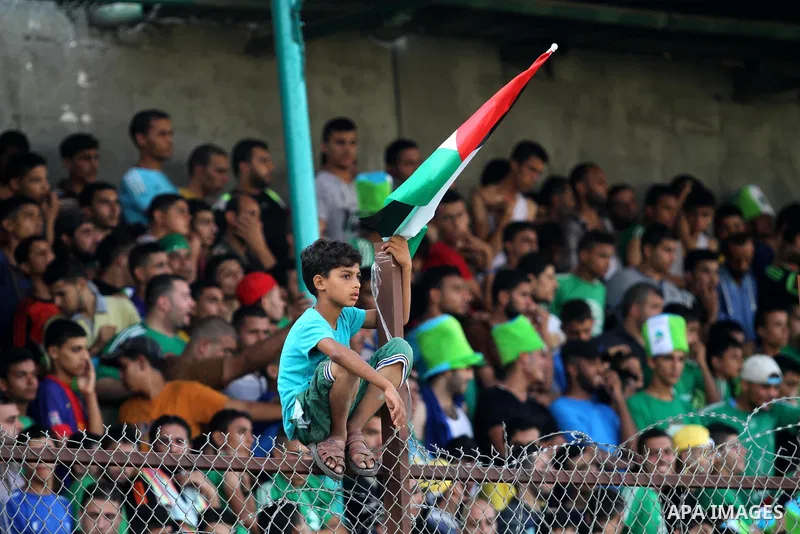 Fans attend the first leg match of the Palestine Cup final between Palestinian Gaza's Shejaya team and Hebron's Al-Ahly team at Yarmuk stadium in Gaza City, on August 6, 2015, as the two teams play each other for the fir...