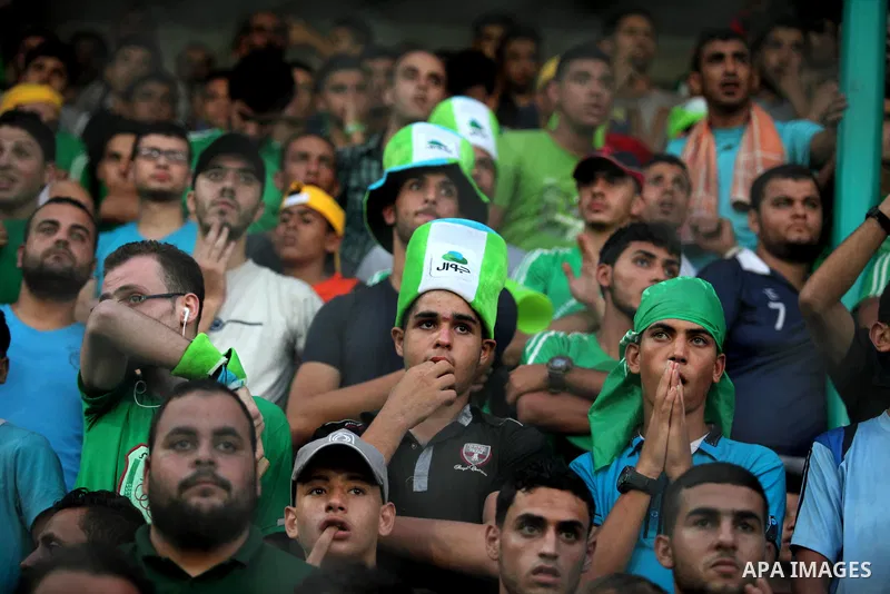 Fans attend the first leg match of the Palestine Cup final between Palestinian Gaza's Shejaya team and Hebron's Al-Ahly team at Yarmuk stadium in Gaza City, on August 6, 2015, as the two teams play each other for the fir...