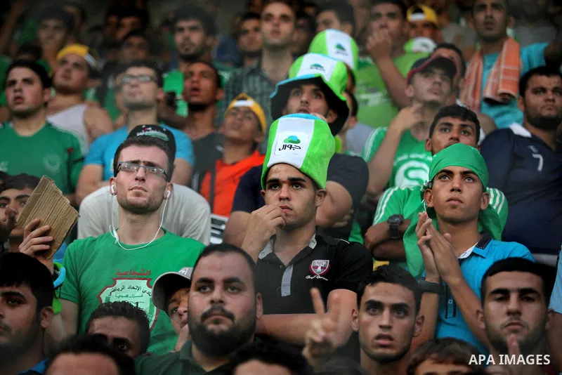 Fans attend the first leg match of the Palestine Cup final between Palestinian Gaza's Shejaya team and Hebron's Al-Ahly team at Yarmuk stadium in Gaza City, on August 6, 2015, as the two teams play each other for the fir...