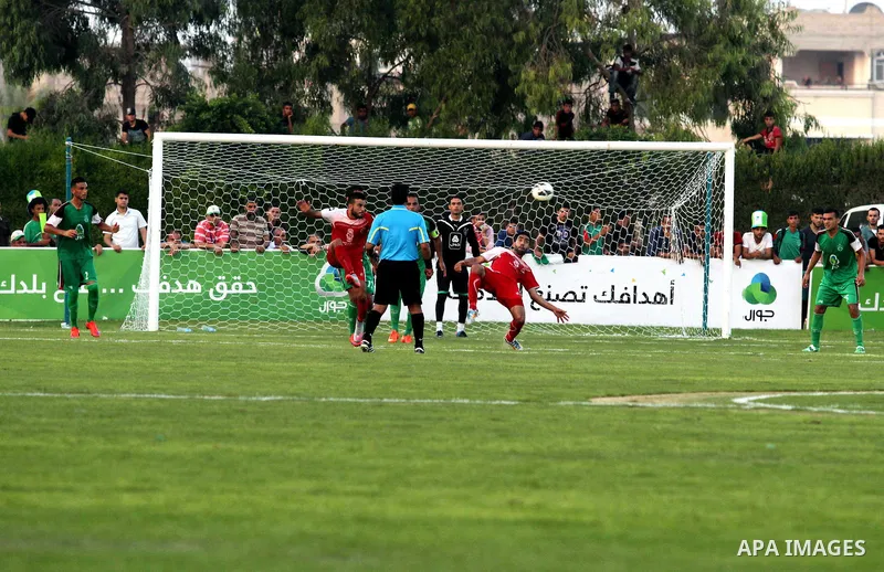 Palestinian Gaza's Shejaya players and Hebron's Al-Ahly players compete during the first leg match of the Palestine Cup final at Yarmuk stadium in Gaza City, on August 6, 2015, as the two teams play each other for the fi...