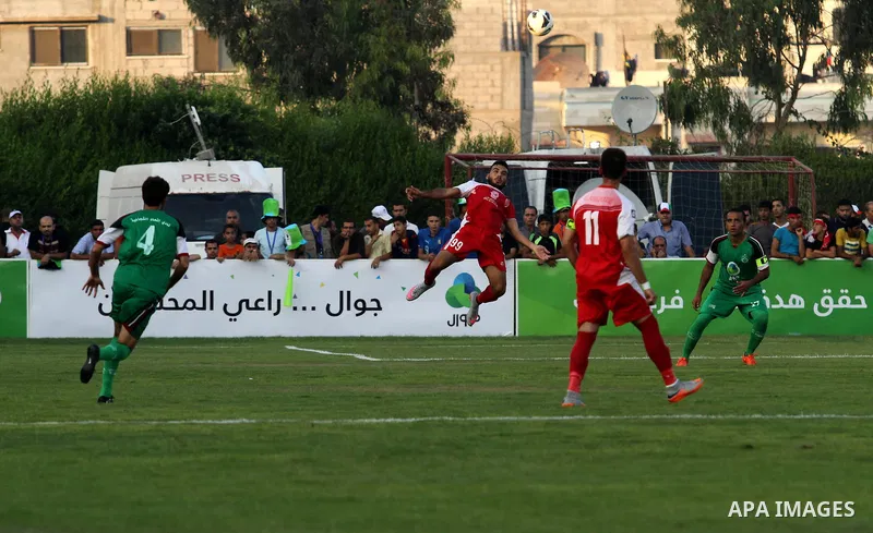 Palestinian Gaza's Shejaya players and Hebron's Al-Ahly players compete during the first leg match of the Palestine Cup final at Yarmuk stadium in Gaza City, on August 6, 2015, as the two teams play each other for the fi...