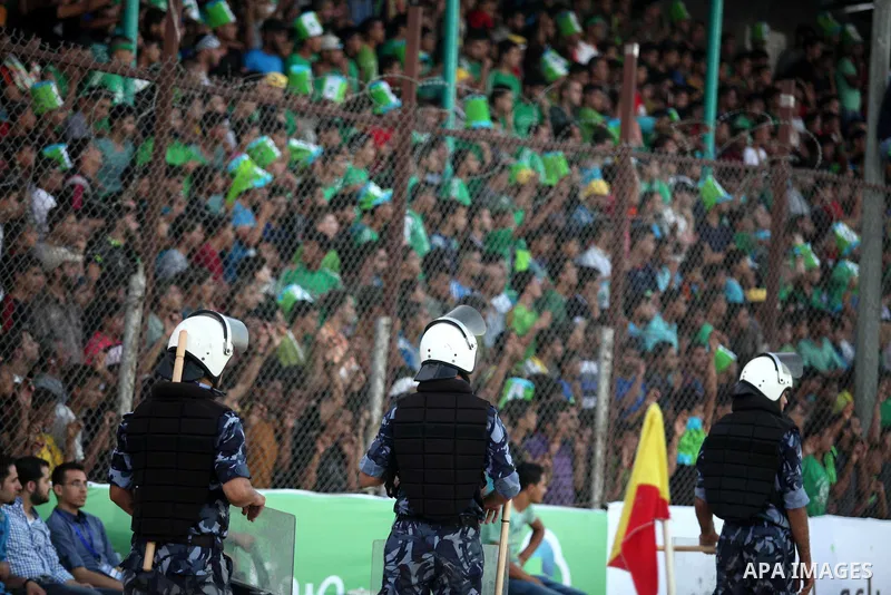 Fans attend the first leg match of the Palestine Cup final between Palestinian Gaza's Shejaya team and Hebron's Al-Ahly team at Yarmuk stadium in Gaza City, on August 6, 2015, as the two teams play each other for the fir...