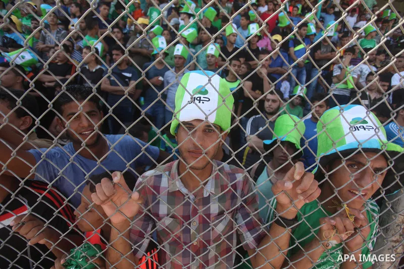 Fans attend the first leg match of the Palestine Cup final between Palestinian Gaza's Shejaya team and Hebron's Al-Ahly team at Yarmuk stadium in Gaza City, on August 6, 2015, as the two teams play each other for the fir...