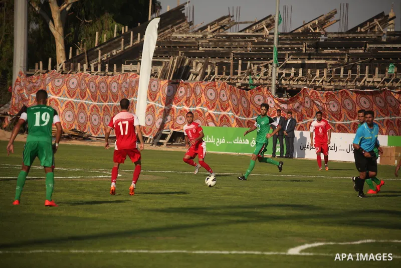 Palestinian Gaza's Shejaya players and Hebron's Al-Ahly players compete during the first leg match of the Palestine Cup final at Yarmuk stadium in Gaza City, on August 6, 2015, as the two teams play each other for the fi...