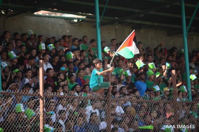 Fans attend the first leg match of the Palestine Cup final between Palestinian Gaza's Shejaya team and Hebron's Al-Ahly team at Yarmuk stadium in Gaza City, on August 6, 2015, as the two teams play each other for the fir...