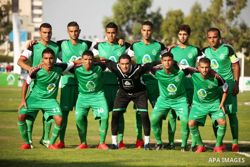 Palestinian Gaza's Shejaya players pose for a picture before the first leg match of the Palestine Cup final with Hebron's Al-Ahly team at Yarmuk stadium in Gaza City, on August 6, 2015, as the two teams play each other f...