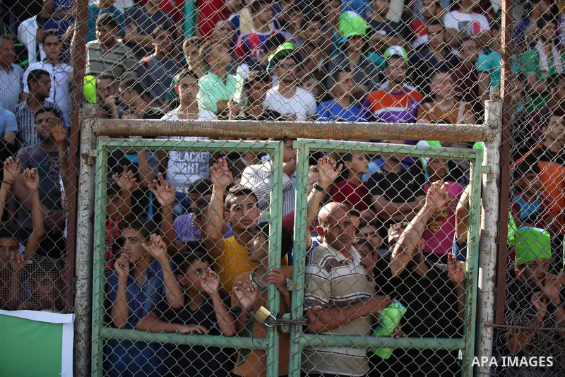 Fans attend the first leg match of the Palestine Cup final between Palestinian Gaza's Shejaya team and Hebron's Al-Ahly team at Yarmuk stadium in Gaza City, on August 6, 2015, as the two teams play each other for the fir...
