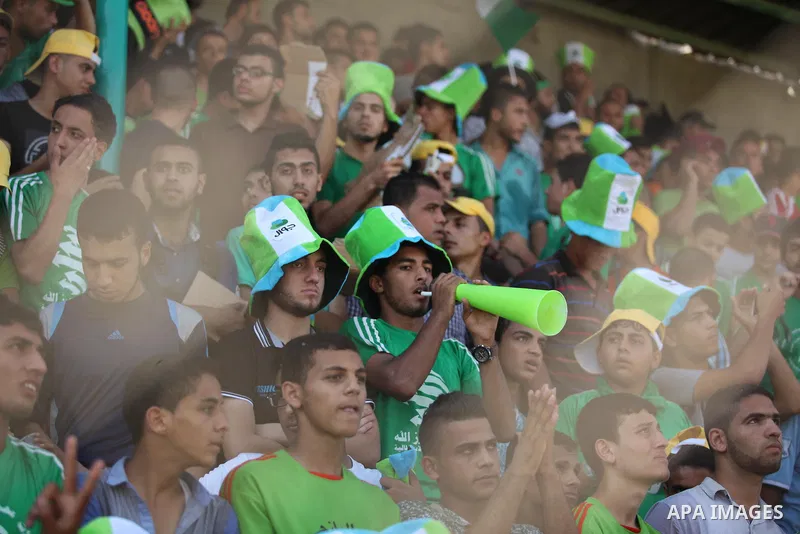 Fans attend the first leg match of the Palestine Cup final between Palestinian Gaza's Shejaya team and Hebron's Al-Ahly team at Yarmuk stadium in Gaza City, on August 6, 2015, as the two teams play each other for the fir...