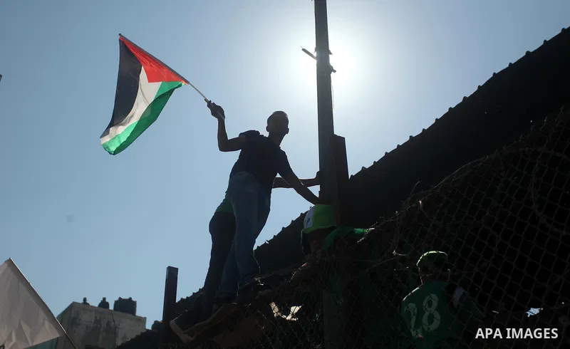 Fans attend the first leg match of the Palestine Cup final between Palestinian Gaza's Shejaya team and Hebron's Al-Ahly team at Yarmuk stadium in Gaza City, on August 6, 2015, as the two teams play each other for the fir...