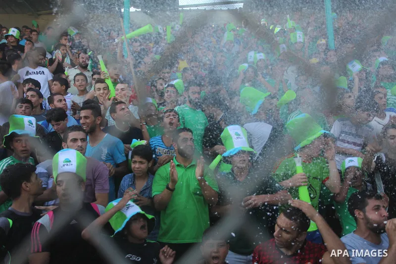 Fans attend the first leg match of the Palestine Cup final between Palestinian Gaza's Shejaya team and Hebron's Al-Ahly team at Yarmuk stadium in Gaza City, on August 6, 2015, as the two teams play each other for the fir...