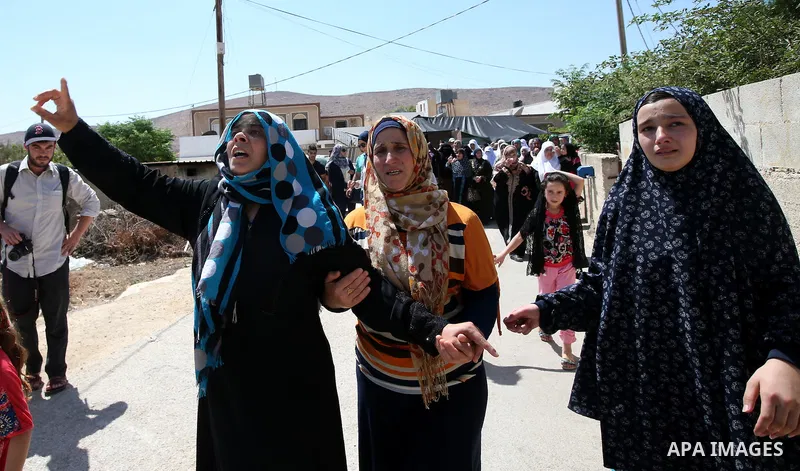 A relative mourns during the funeral of Saad Dawabsha, the father of a Palestinian toddler killed last week when their home was firebombed by Jewish extremists, in the West Bank village of Duma on August 8, 2015. Dawabsh...