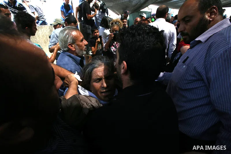A relative mourns during the funeral of Saad Dawabsha, the father of a Palestinian toddler killed last week when their home was firebombed by Jewish extremists, in the West Bank village of Duma on August 8, 2015. Dawabsh...