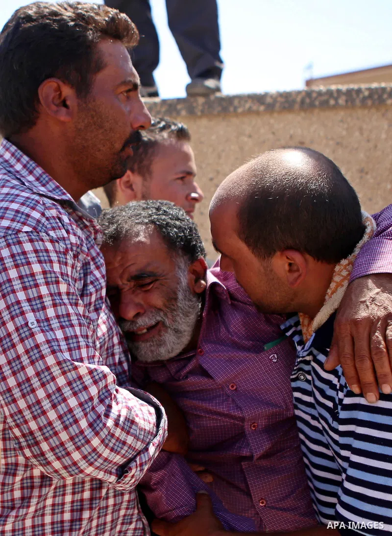 A relative mourns during the funeral of Saad Dawabsha, the father of a Palestinian toddler killed last week when their home was firebombed by Jewish extremists, in the West Bank village of Duma on August 8, 2015. Dawabsh...