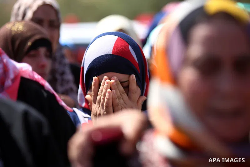 A relative mourns during the funeral of Saad Dawabsha, the father of a Palestinian toddler killed last week when their home was firebombed by Jewish extremists, in the West Bank village of Duma on August 8, 2015. Dawabsh...