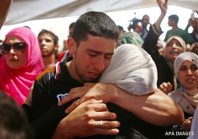 Relatives mourn during the funeral of Saad Dawabsha, the father of a Palestinian toddler killed last week when their home was firebombed by Jewish extremists, in the West Bank village of Duma on August 8, 2015. Dawabsha...