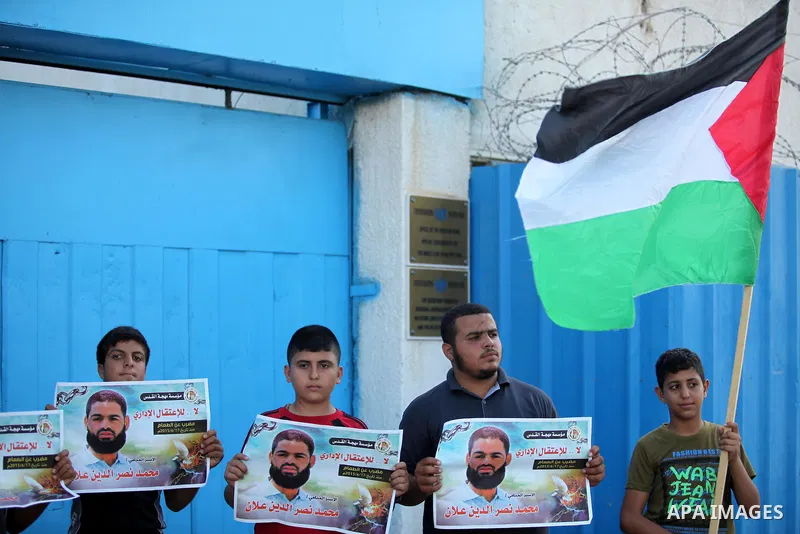 Protesters hold portraits of Palestinian prisoner in Israeli jails Mohammad Allan, during a protest outside United Nations headquarter, in Gaza city on August 8, 2015. The Israeli military prosecutor intends to request c...