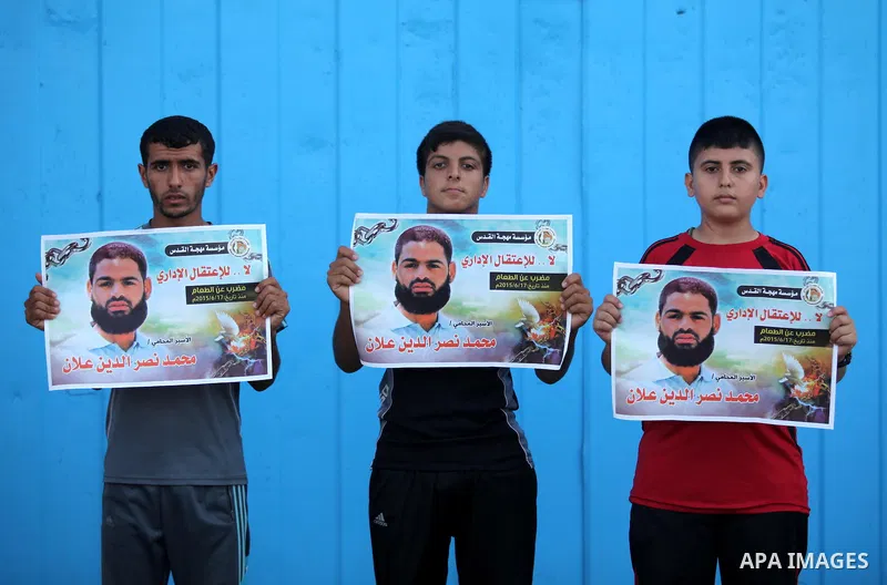 Protesters hold portraits of Palestinian prisoner in Israeli jails Mohammad Allan, during a protest outside United Nations headquarter, in Gaza city on August 8, 2015. The Israeli military prosecutor intends to request c...