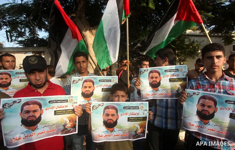 Protesters hold portraits of Palestinian prisoner in Israeli jails Mohammad Allan, during a protest outside United Nations headquarter, in Gaza city on August 8, 2015. The Israeli military prosecutor intends to request c...