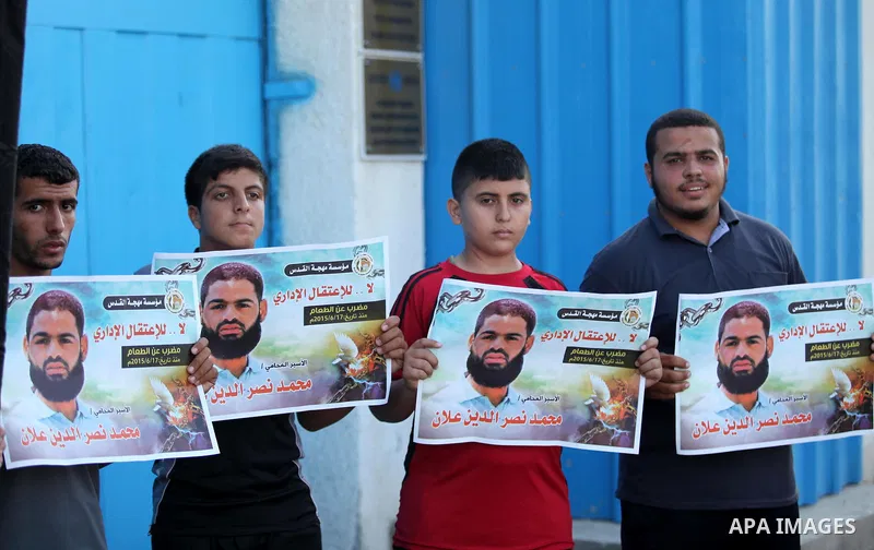 Protesters hold portraits of Palestinian prisoner in Israeli jails Mohammad Allan, during a protest outside United Nations headquarter, in Gaza city on August 8, 2015. The Israeli military prosecutor intends to request c...