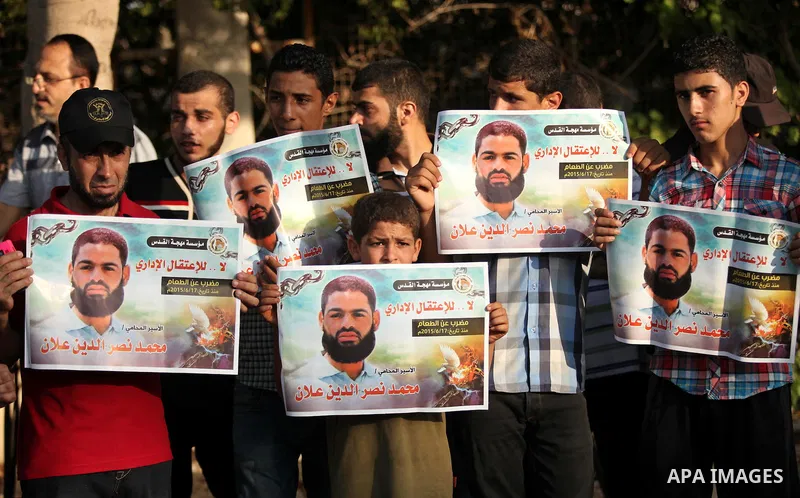 Protesters hold portraits of Palestinian prisoner in Israeli jails Mohammad Allan, during a protest outside United Nations headquarter, in Gaza city on August 8, 2015. The Israeli military prosecutor intends to request c...