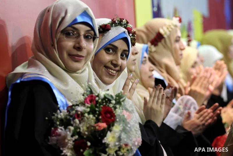Palestinian students take part in their graduation ceremony at the Islamic University in Gaza city on August 9, 2015. Photo by Mohammed Asad