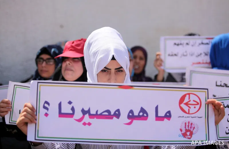 Palestinians supporters of the Popular Front for the Liberation of Palestine (PFLP) take part in a protest against the reduction of educational programs given by the United Nations Relief and Works Agency (UNRWA) in Gaza...
