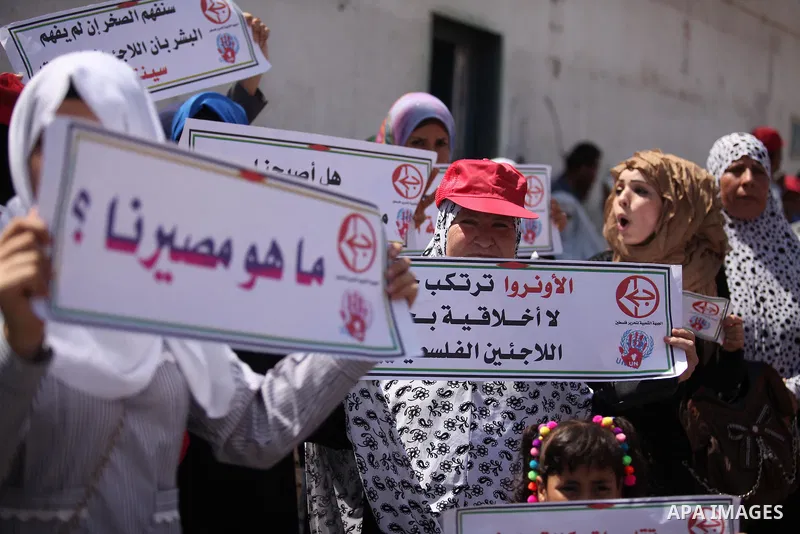 Palestinians supporters of the Popular Front for the Liberation of Palestine (PFLP) take part in a protest against the reduction of educational programs given by the United Nations Relief and Works Agency (UNRWA) in Gaza...